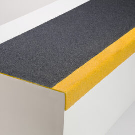 Stair tread cover in black and yellow