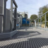 Floor view of grey grating being used as a maintenance platform