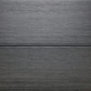 Close up of the back of two WPC woodgrain decking boards in Slate Grey
