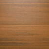 Close up of the back of two WPC woodgrain decking boards in Teak