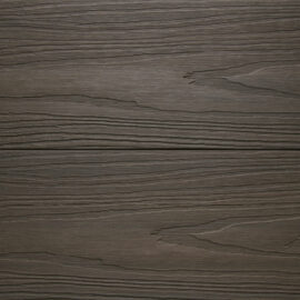 Close up of two WPC woodgrain decking boards in Walnut
