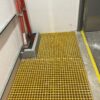Yellow grating used as a riser floor