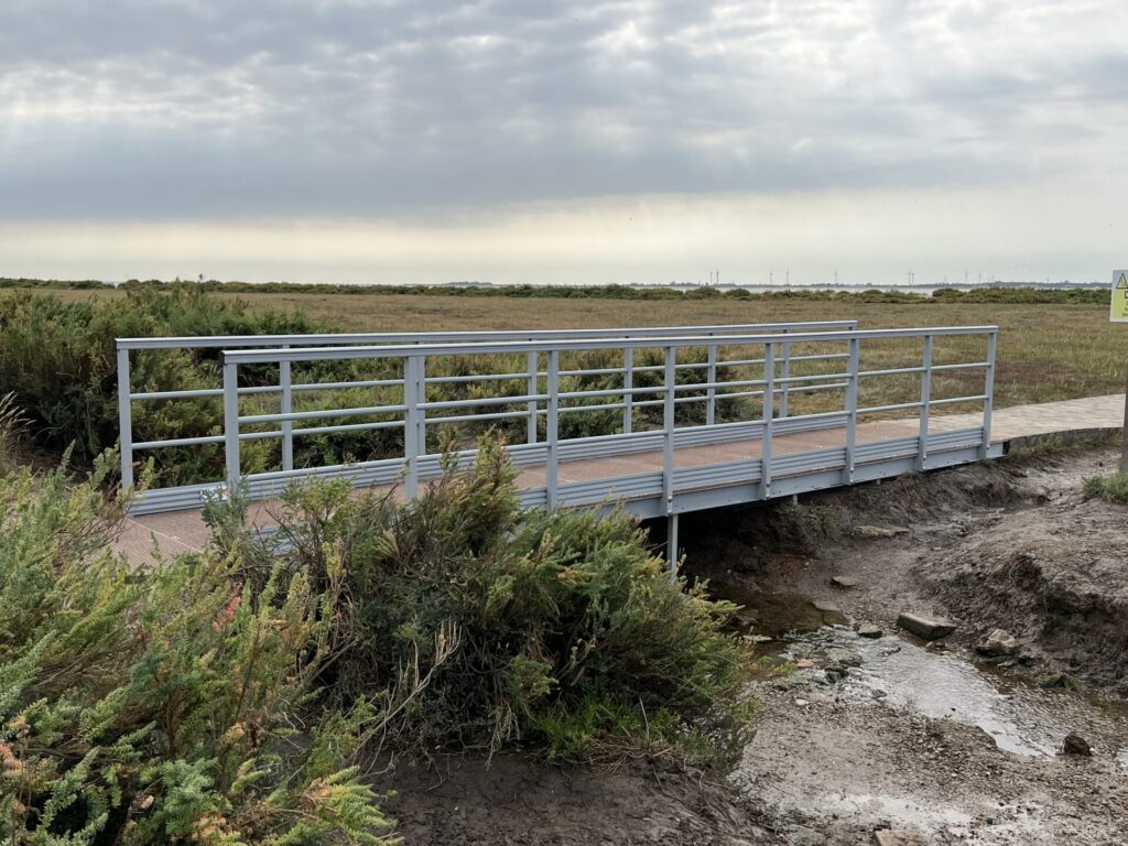 A GRP Walkway footbridge installed over a stream on West Mersea